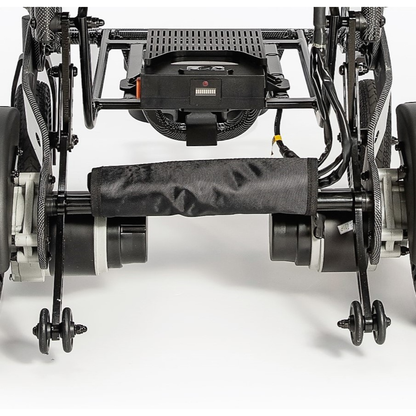 Close-up of the rear wheels and motor components of the Miracle Mobility Palladium 8500 Portable Powerchair, highlighting detailed mechanical parts and wiring against a white background.