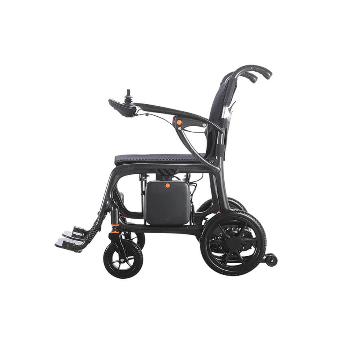 The Foldawheel Model CX Lightweight Portable Powerchair weighs just 28 lbs and features right-armrest joystick control, padded seat and backrest, footrests, and compact wheels, shown from the side against a white background.