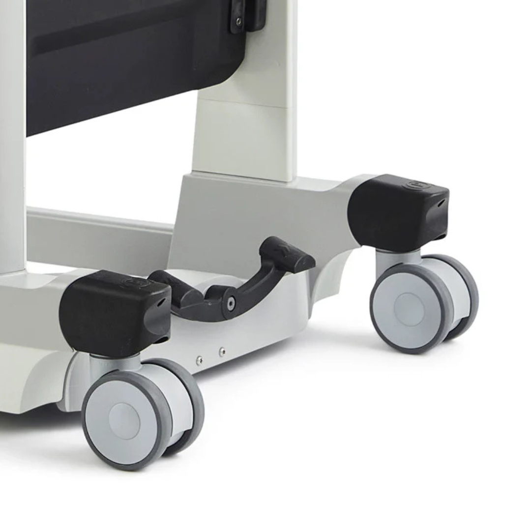 Close-up of the bottom part of the Molift Transfer Pro - Innovative Sit-To-Stand Patient Lift, featuring two gray double wheels with black wheel covers, displayed on a white background.
