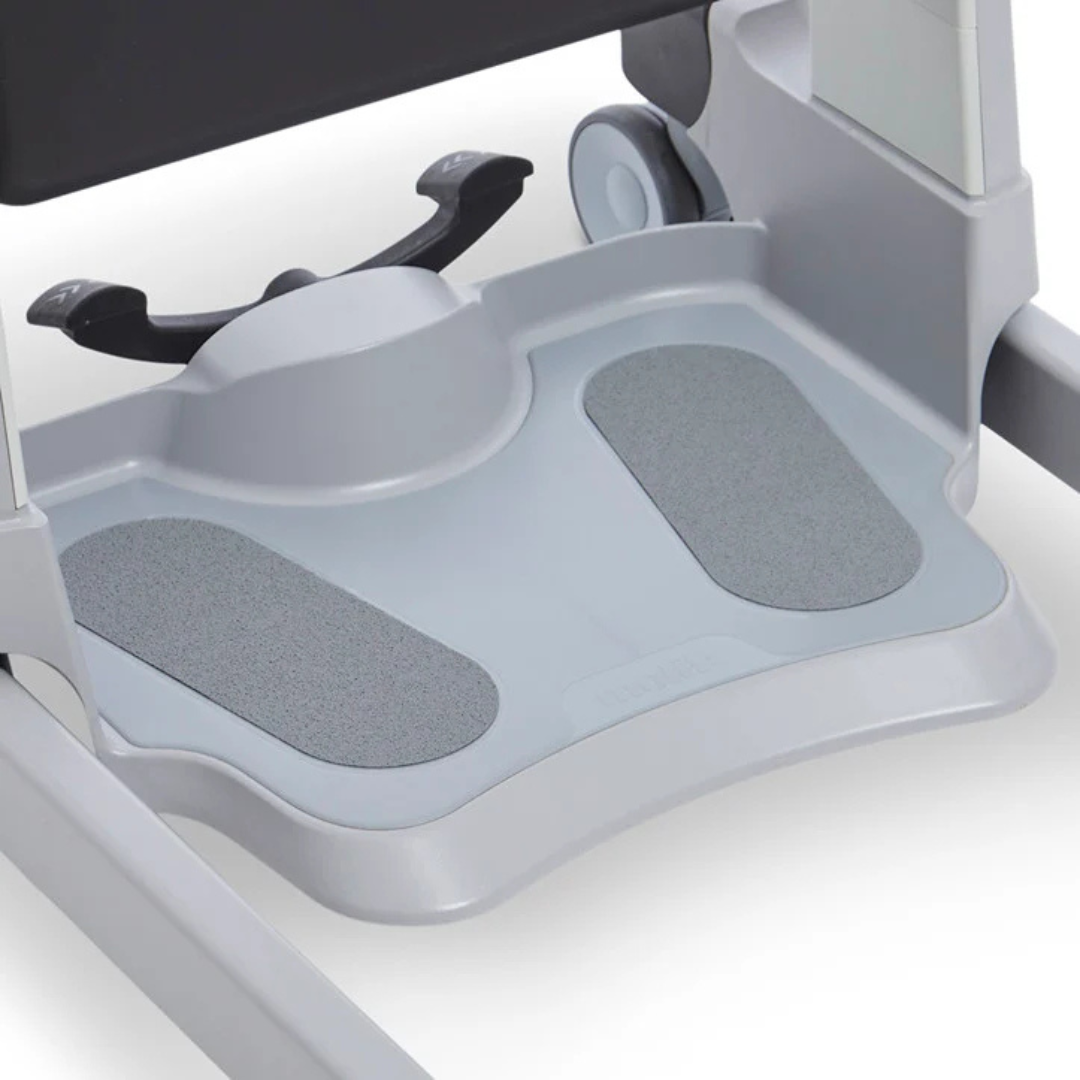 A close-up of a gray plastic footrest with textured, non-slip pads, attached to the base of the Molift Transfer Pro - Innovative Sit-To-Stand Patient Lift.