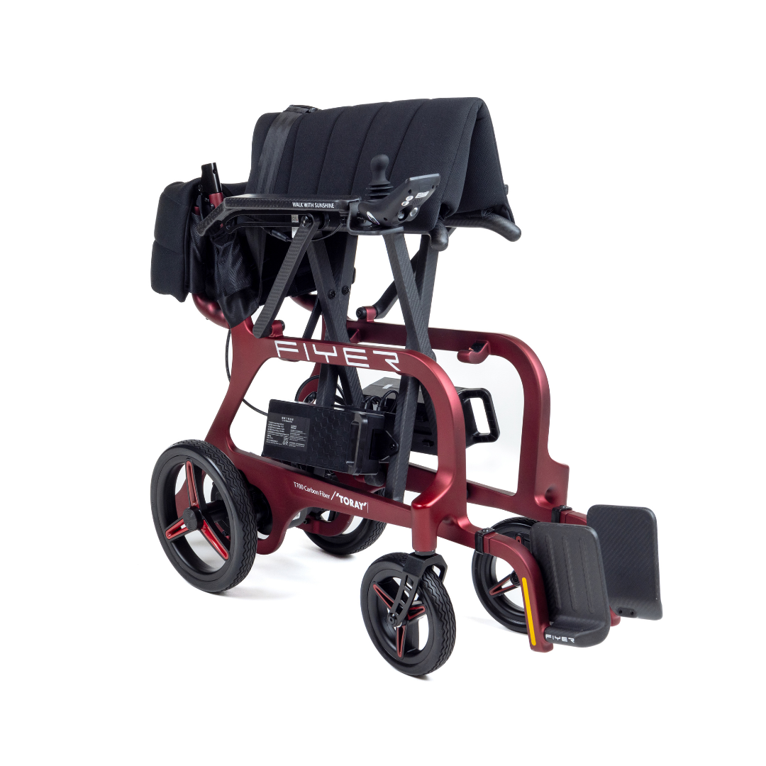 The Monarch Flyer Ultra-Lite Carbon Powerchair is a modern red and black mobility device with four large wheels, padded seat, armrests, footrest, and partial folding for easy transport. See specs and videos to learn more about its features.