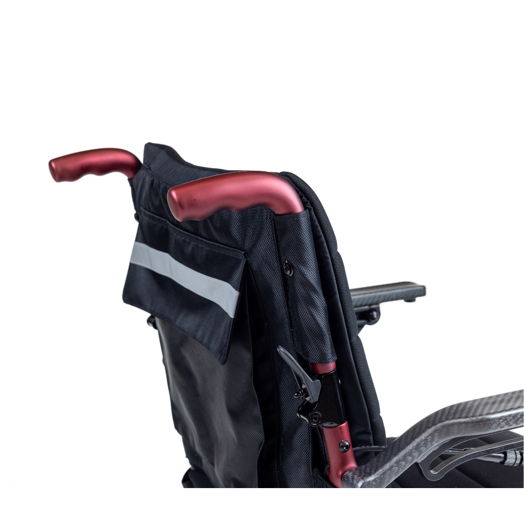 Close-up of the Monarch Flyer Ultra-Lite Carbon Powerchair's back, highlighting metallic red push handles and a black storage pouch with reflective strip—emphasizing handle design and upper section for product spec display.