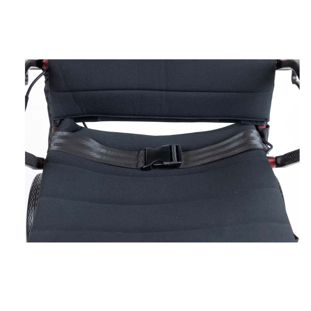 Close-up of the Monarch Flyer Ultra-Lite Carbon Powerchair’s black seat with a fastened safety belt, showing part of the backrest and armrests on a white background. See specifications or videos for more details.