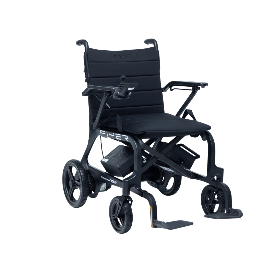 The Monarch Flyer Ultra-Lite Carbon Powerchair is a lightweight, black electric wheelchair with armrests, footrests, large rear wheels, small front wheels, and "Flyer" branding on the seat. Please check specifications or warranty details for more information.