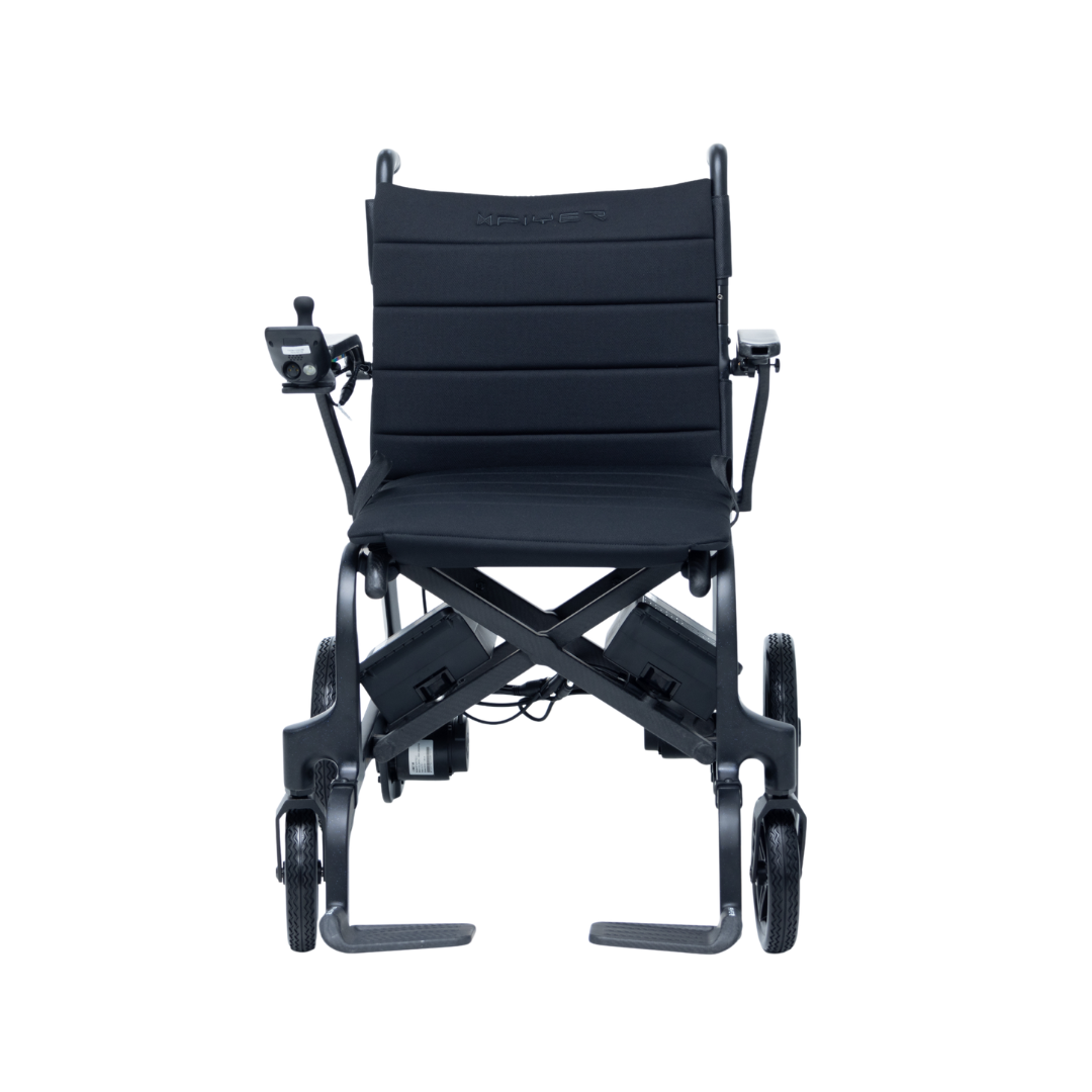 The Monarch Flyer Ultra-Lite Carbon Powerchair is a lightweight, foldable electric wheelchair with a black cushioned seat and backrest, joystick armrest control, four wheels, and shown from the front on a white background. See specs and warranty for details.