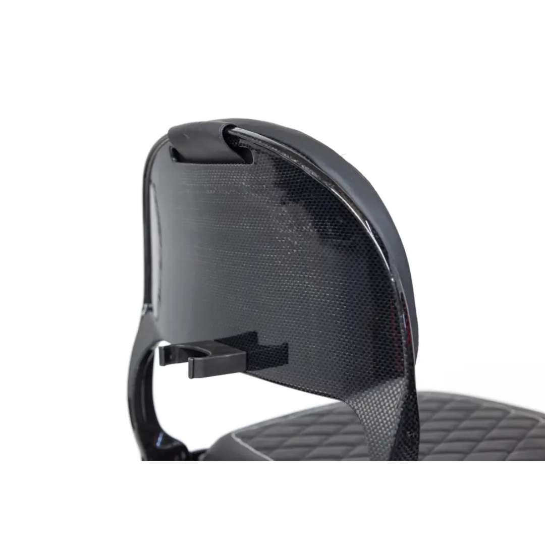 Close-up of the backrest of the Monarch Genie Ultralight Portable Mobility Scooter, featuring a glossy black design and quilted seat upholstery with a small horizontal attachment on the backrest.