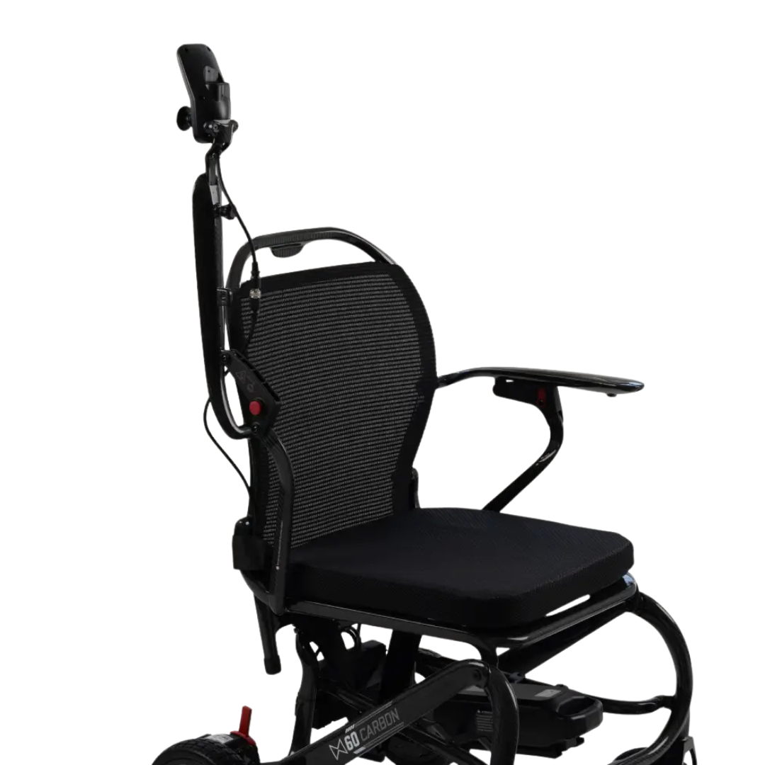 Introducing the Monarch MM60 Carbon Ultralite Electric Wheelchair in sleek black, featuring a mesh backrest, cushioned seat, raised armrests, and a high headrest—all displayed against a white background. This ultra-lightweight folding wheelchair seamlessly blends contemporary style with practical features to ensure superior comfort and mobility for everyday use.
