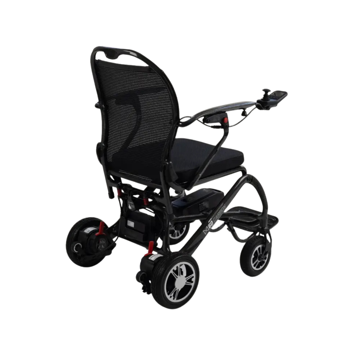 The Monarch MM60 Carbon Ultralite Electric Wheelchair is an ultra-lightweight folding model featuring a black mesh backrest, padded seat, and joystick control on the right armrest, displayed from a rear-side angle against a white background.