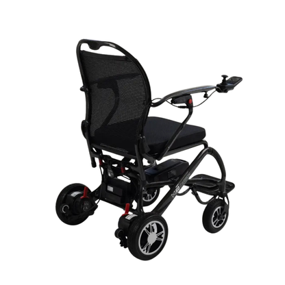 The Monarch MM60 Carbon Ultralite Electric Wheelchair is an ultra-lightweight folding model featuring a black mesh backrest, padded seat, and joystick control on the right armrest, displayed from a rear-side angle against a white background.