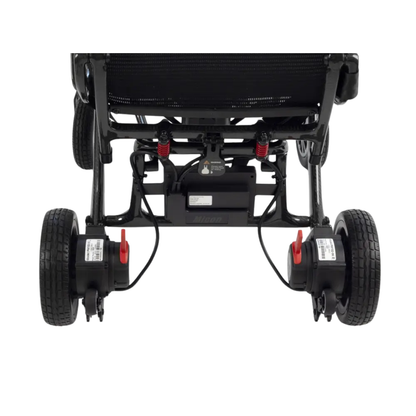 Rear view of the bottom part of a Monarch MM60 Carbon Ultralite Electric Wheelchair in black, displaying large wheels, suspension springs, battery pack, and mechanical components against a white background.