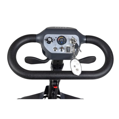 Close-up of the Monarch Genie Auto Folding Portable Scooter control panel, featuring a steering handle, buttons, switches, and an ignition key with a white keychain—ideal for anyone needing detailed info before purchasing.