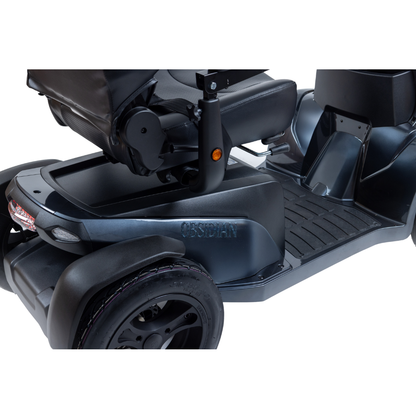 Close-up side view of a Monarch Obsidian HD Outdoor Mobility Scooter in black, highlighting the seat, footrest, and rear wheel. See specifications for details or watch videos to explore its unique features.