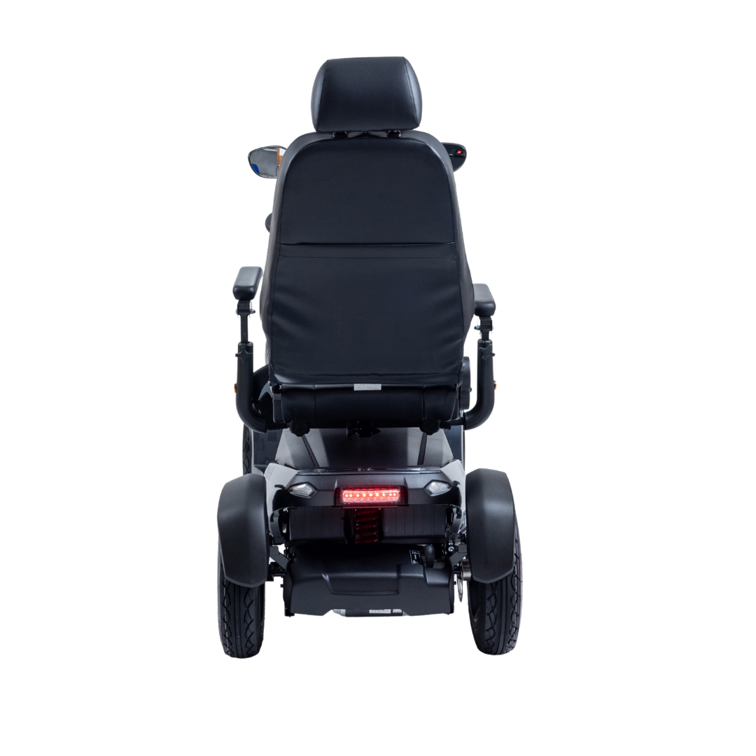 A rear view of the Monarch Obsidian HD Outdoor Mobility Scooter in black, featuring a cushioned seat, armrests, and rear lights, is shown against a white background. Review specifications and warranty info for confidence in your purchase.