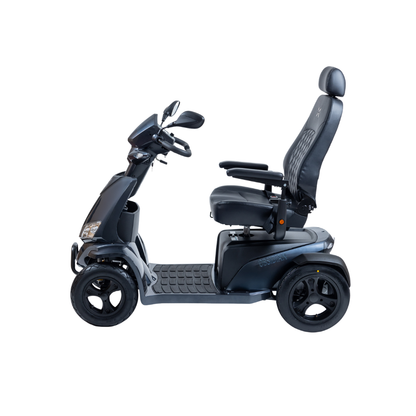 The Monarch Obsidian HD Outdoor Mobility Scooter, shown in black with four wheels, a cushioned seat with armrests and headrest, and side-view handlebars, is pictured against a white background. See specs and warranty info for details.