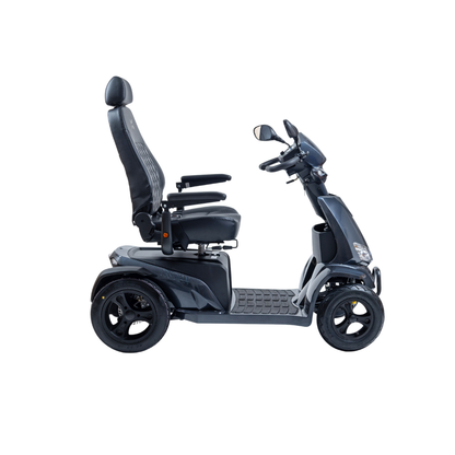 The Monarch Obsidian HD Outdoor Mobility Scooter, a modern four-wheeled model with a high-backed seat, armrests, and rearview mirrors, is shown from the side on a white background; see specs and warranty info for details.