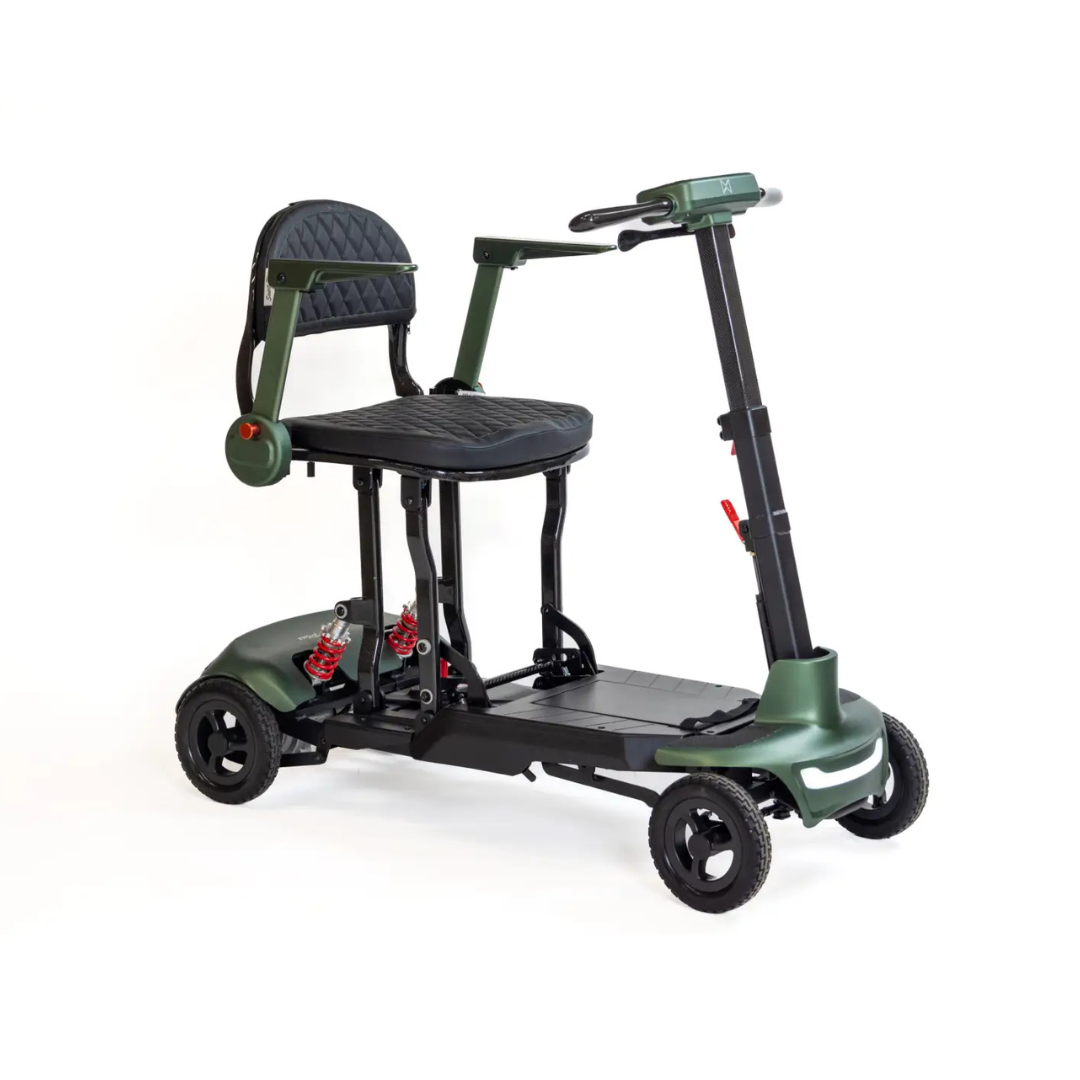 The Monarch Smarti Plus Ultra-Lite Auto Folding Scooter is a compact, green four-wheel mobility scooter with a padded seat, armrests, and handlebar for steering, shown on a white background. The description appears to be CSS code instead of product details.