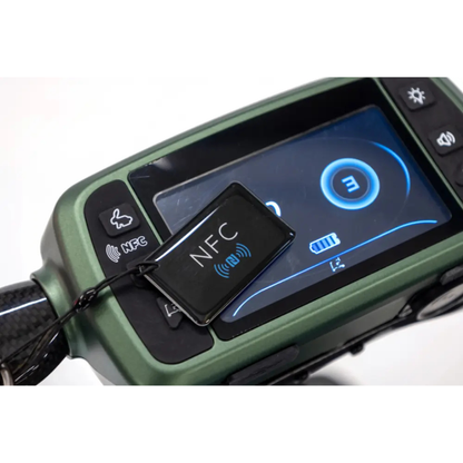 A close-up of the Monarch Smarti Plus Ultra-Lite Auto Folding Scooter’s electronic dashboard with a digital display and a black NFC key tag featuring the NFC symbol, plus dashboard buttons and an icon display screen.