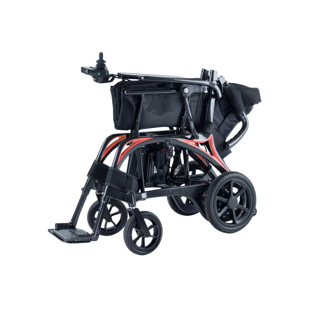 The Monarch Ezi Fold Carbon Portable Power Wheelchair features a lightweight black and red frame, foldable design for compact transport, footrests, and small front wheels.