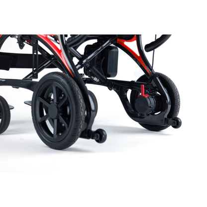 Close-up of the lower section of the Monarch Ezi Fold Carbon Portable Power Wheelchair, showcasing black wheels, frame, and mechanical components against a white background.