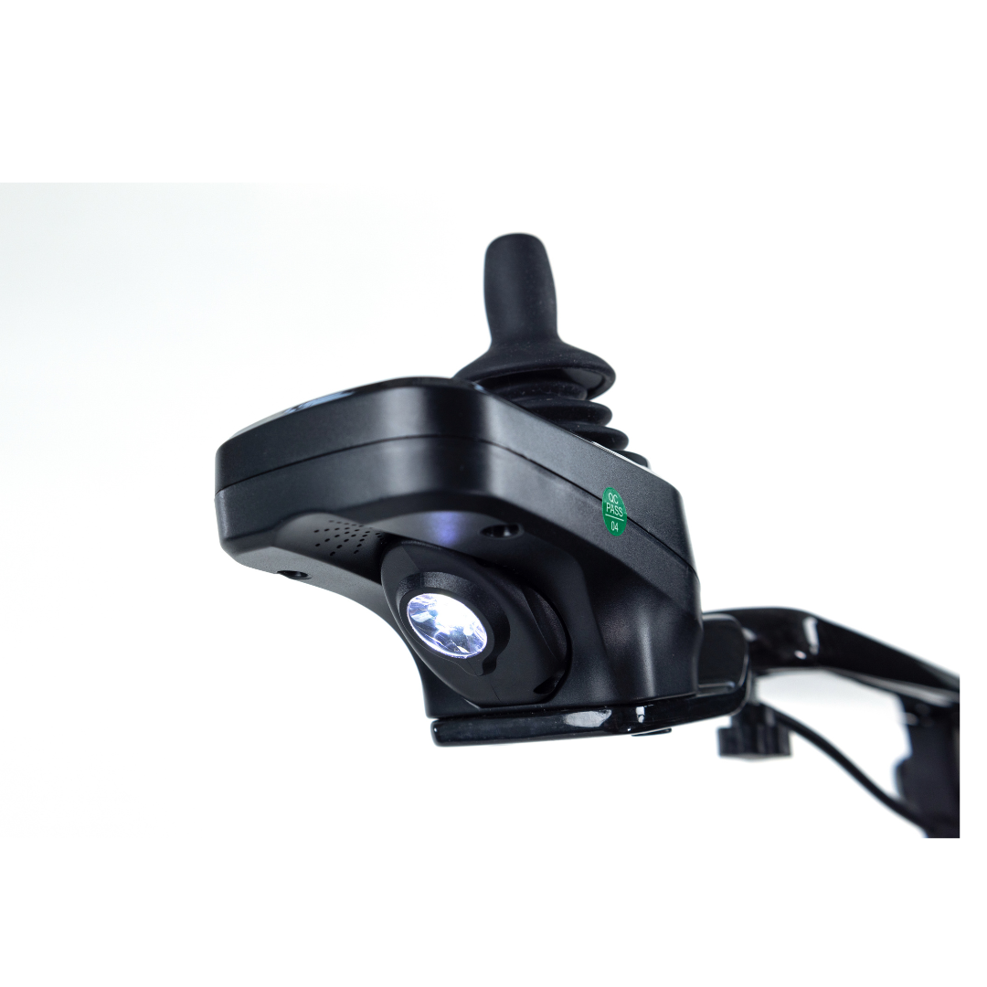 Close-up of a black joystick controller with integrated LED light, mounted on a metal arm, from the Monarch Ezi Fold Carbon Portable Power Wheelchair, shown against a white background.