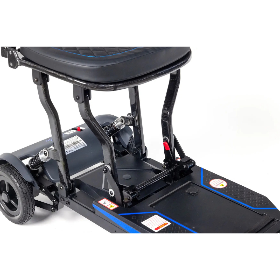 Close-up of the Monarch Supa Carbon Lite Ultra-Lightweight Carbon-Fiber Scooter’s lower section, highlighting seat supports, rear wheels, suspension springs, and footrest platform for a detailed technical view of its carbon fiber design.