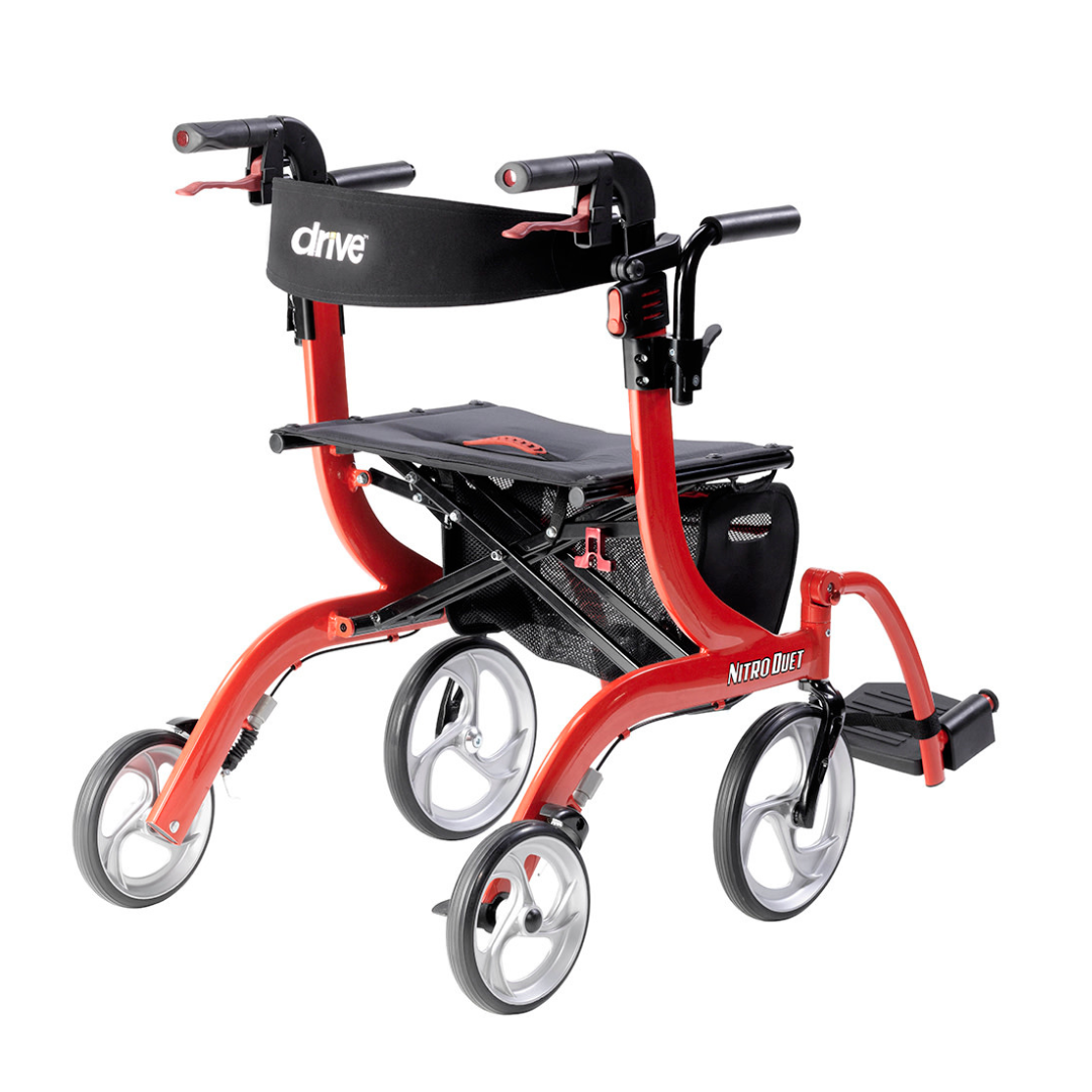 The Drive Hybrid Nitro® Duet Rollator and Transport Chair is a red and black lightweight mobility aid featuring four large wheels, seat, labeled backrest, hand brakes, footrest, and under-seat pouch for comfort and convenience.