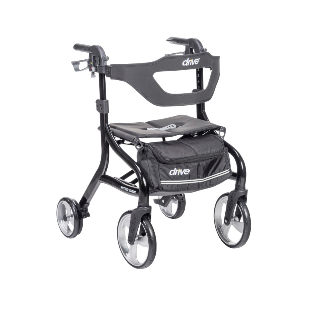 The Drive Nitro® Sprint Rollator with Accessory Bundle is a black, lightweight rollator featuring four wheels, a seat, storage pouch, sturdy frame, and hand brakes for mobility assistance. Branding appears on the backrest and pouch.