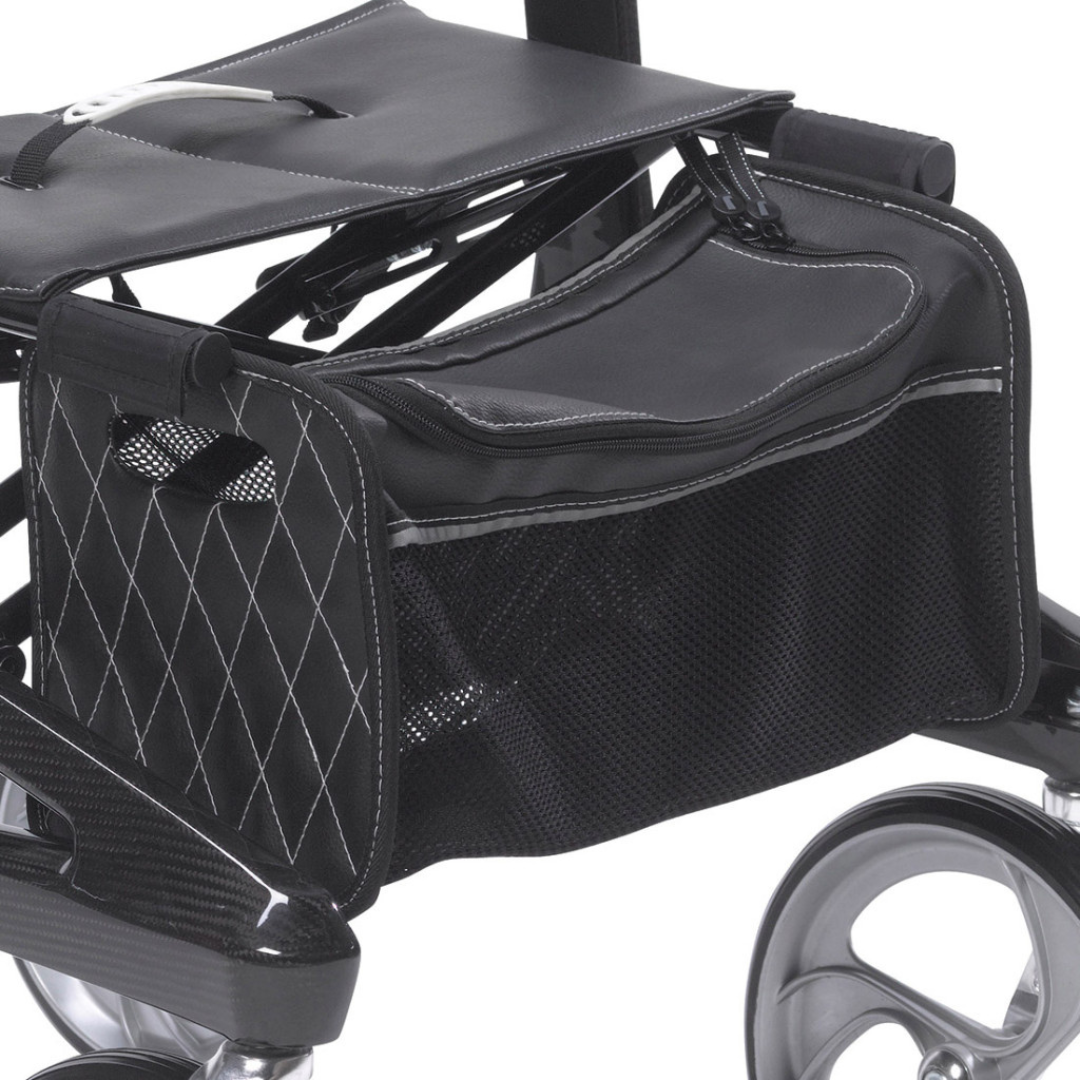 Close-up of the Drive Nitro® Elite CF Carbon Fiber Rollator, featuring a black diamond-stitched storage bag with a mesh pocket and silver trim beneath the seat. Large rear wheels enhance practicality in this ultra-lightweight folding rollator.