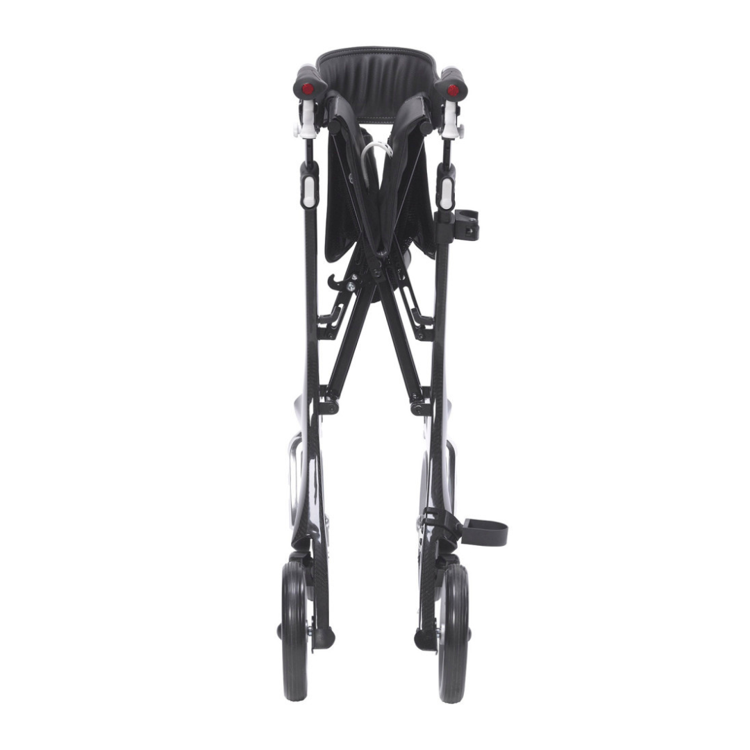 The Drive Nitro® Elite CF Carbon Fiber Rollator, shown from the front in its folded position, features a black frame with dual pairs of wheels and a visible seat.