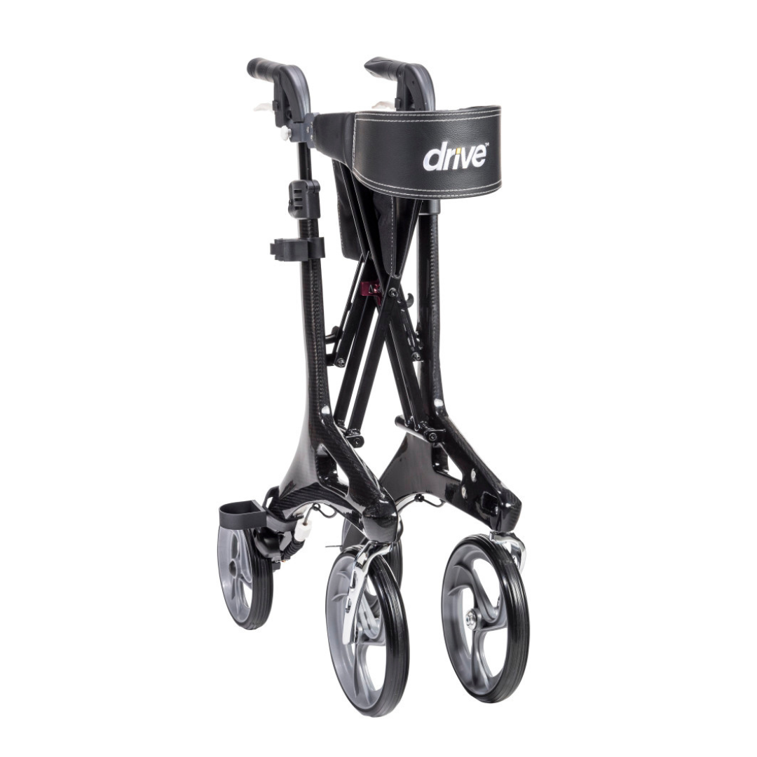 The Drive Nitro® Elite CF Carbon Fiber Rollator is a black, ultra-lightweight walker with large wheels and the Drive logo on the front strap, shown in a compact, upright position.