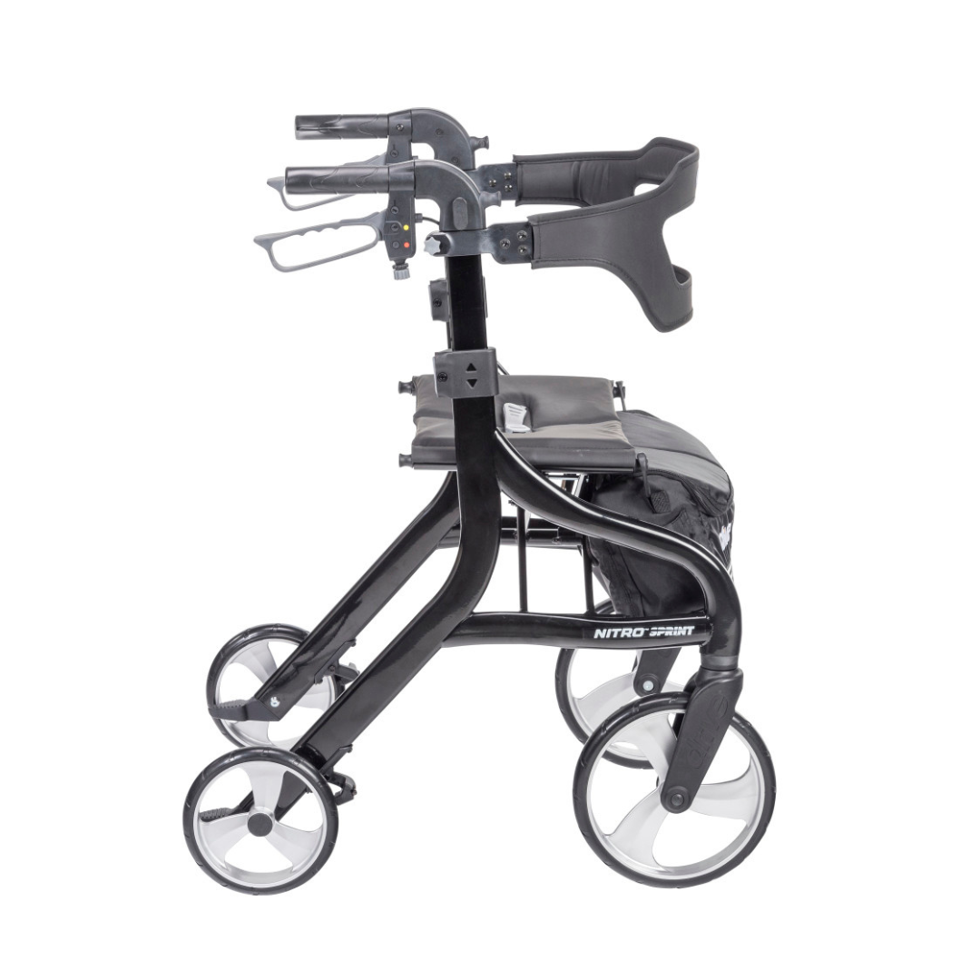 The Drive Nitro® Sprint Rollator with Accessory Bundle, shown in black from the side against a white background, features ergonomic handles, a foldable frame, seat, and storage pouch under the seat.