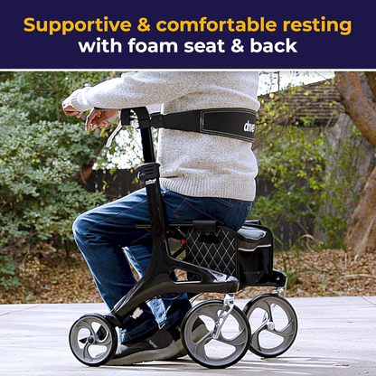 A person sits outdoors on the Drive Nitro® Elite CF Carbon Fiber Rollator with large wheels, lightweight frame, foam seat, and backrest. Text reads: Supportive & comfortable resting with foam seat & back.