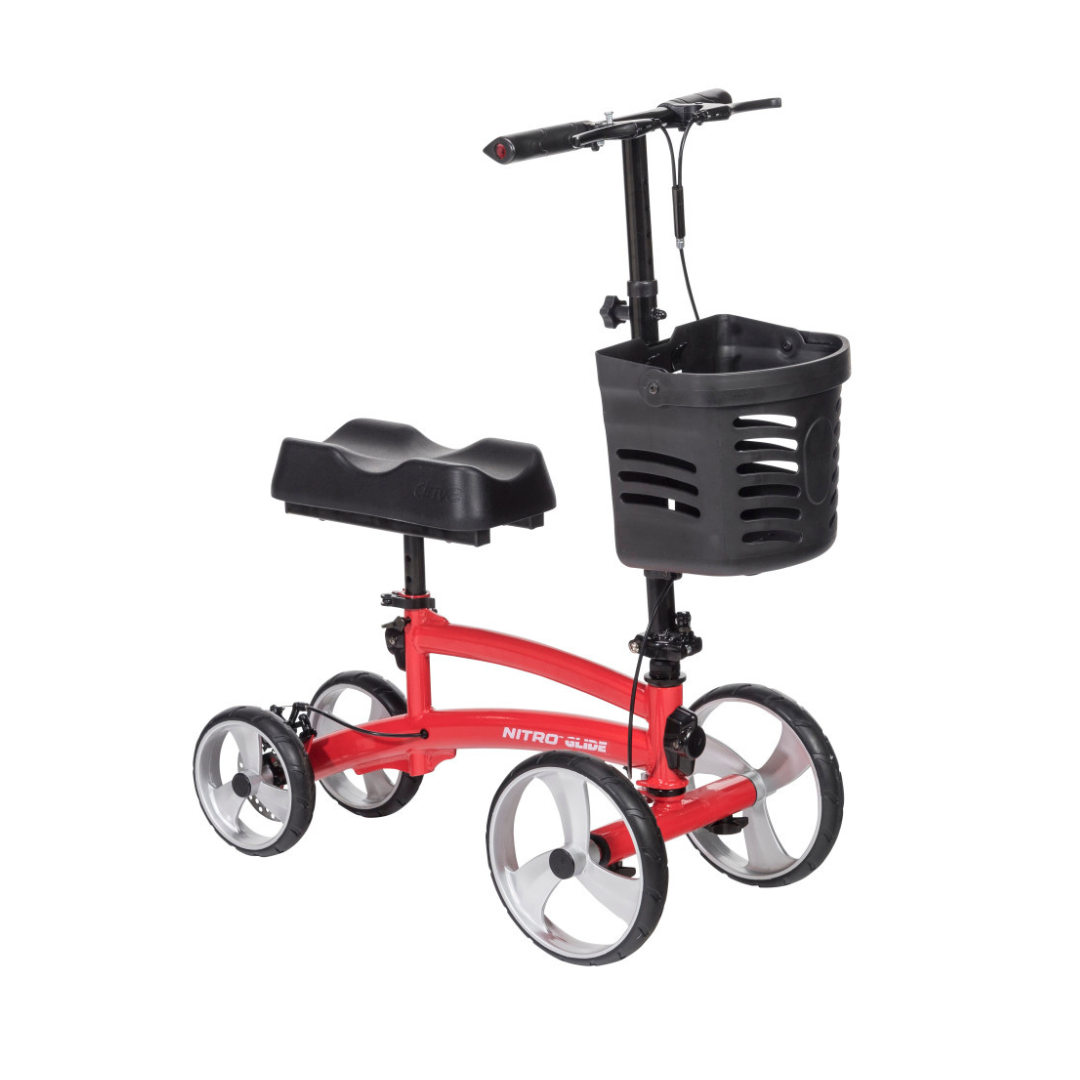 The Drive Folding Nitro® Glide Knee Walker features four large wheels, a black cushioned knee rest, front basket, and handlebars—offering a comfortable crutch alternative for improved mobility and support.
