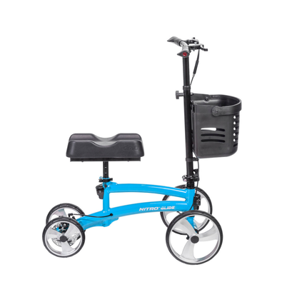 The Drive Folding Nitro® Glide Knee Walker is a blue mobility aid with four wheels, handlebars, a black cushioned knee rest, and a front black basket. It's designed as an alternative to crutches for enhanced comfort during injury recovery.