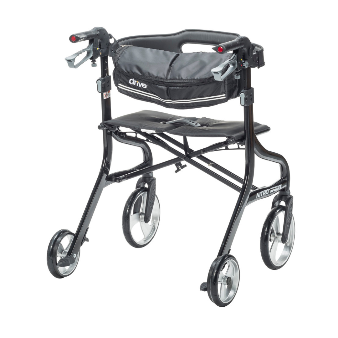 The Drive Nitro® Sprint HD Bariatric Lightweight Rollator is a black, heavy-duty rollator with four wheels, large front wheels for easy all-terrain maneuverability, padded seat, curved backrest, hand brakes, and a storage pouch under the seat.