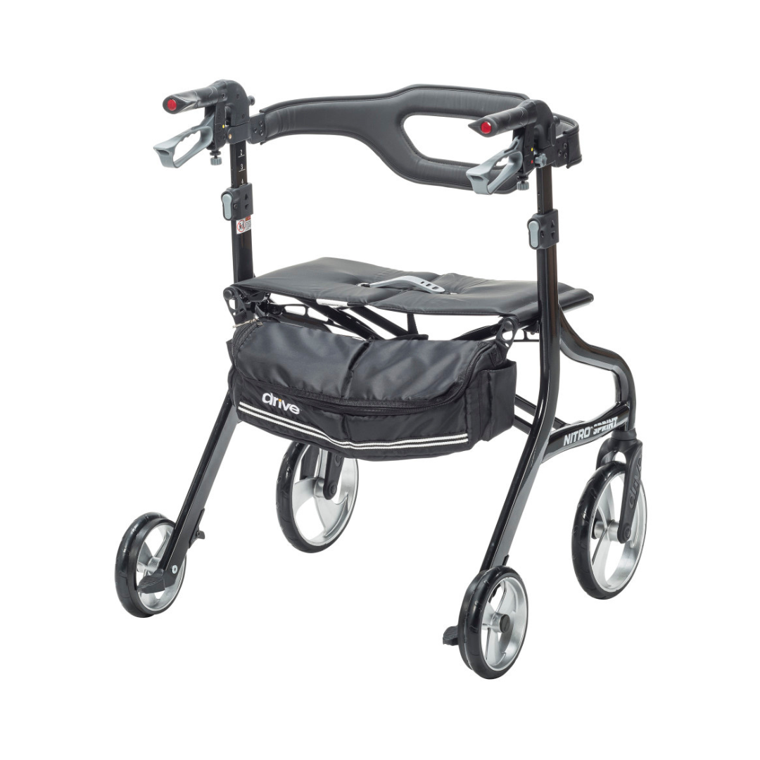 The Drive Nitro® Sprint HD Bariatric Lightweight Rollator is a black, heavy-duty 4-wheel walker with a padded seat, hand brakes, and an under-seat storage pouch. Its lightweight frame and large front wheels provide easy maneuverability on different terrains.