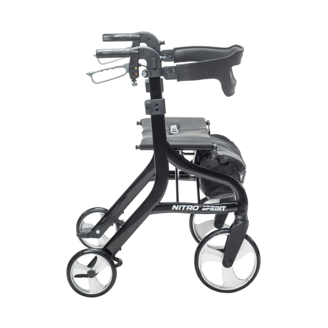 The Drive Nitro® Sprint HD Bariatric Lightweight Rollator, shown in black from the side, features four wheels, a seat, padded backrest, and a storage pouch.
