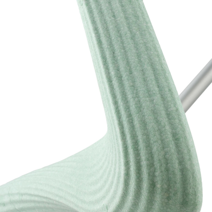 Close-up of the light green, textured back and seat with wavy, layered lines on the byACRE Nordic Pioneer Lightweight Folding Rollator—only 13 lbs. A metallic rod in the background hints at this modern mobility aid’s sleek structure.
