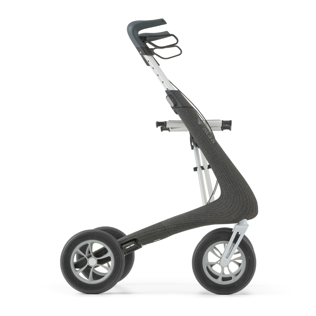 The byACRE Nordic Pioneer Lightweight Folding Rollator (only 13 lbs) features a modern, minimalist design with two large front wheels, a single smaller rear wheel, a curved frame, and ergonomic handlebars, displayed in profile on a white background.