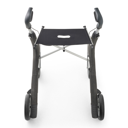 A top-down view of the byACRE Nordic Pioneer Lightweight Folding Rollator—only 13 lbs—shows its sleek black and silver frame, four wheels, comfy hand grips, and built-in seat set against a white background.