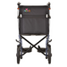 A rear view of the Nova Medical 330 Lightweight Transport Chair highlights its foldable aluminum frame and black fabric with the Nova logo on the backrest. Equipped with XL rear wheels, smaller front wheels, and handles featuring hand brakes, this transport chair ensures easy maneuverability.