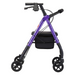 The Nova Medical Star 6 OS Rollator Walker, shown from the side on a white background, features a lightweight and foldable design accommodating users from 5'1" to 6'2". It comes in purple with four wheels, black handles, and a black seat. The walker incorporates NOVA's patented locking hand brakes for safety, has a handy black storage bag beneath the seat, and boasts its Quick-Fit adjustable design for added comfort.