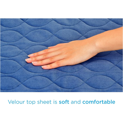 A hand touches the blue quilted surface of the Nova Ultra Reusable Waterproof Underpad For Chairs (21" x 22"), showcasing its soft, velour top sheet and cozy, comfortable feel. Perfect protection with a stylish wavy pattern in blue.