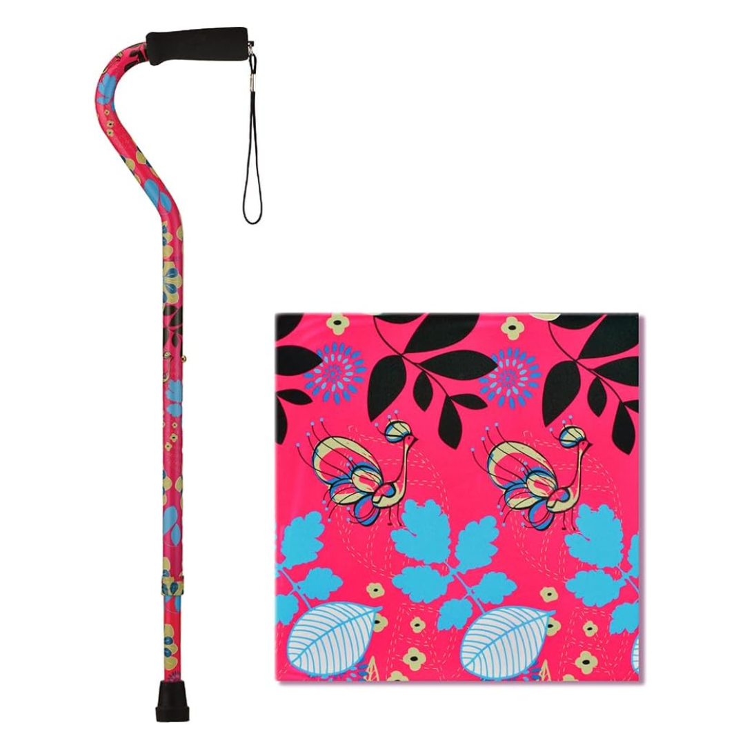 The Nova Designer Offset Walking Cane features a bright pink background with vibrant blue, yellow, black, and white floral and butterfly patterns. A close-up detail highlights the stylish design next to the cane.