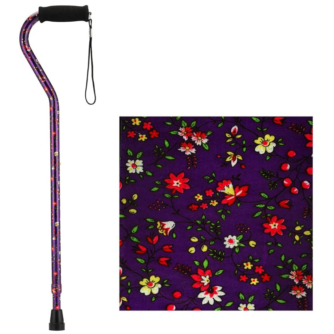The Nova Designer Offset Walking Cane showcases a vibrant floral pattern on purple, with a black handle and wrist strap. A close-up reveals the cane’s detailed floral design for added style and elegance.