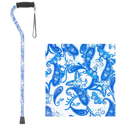 The Nova Designer Offset Walking Cane features a blue and white paisley and butterfly pattern, black foam handle with wrist strap, rubber tip, and a close-up view of the designer pattern is shown.