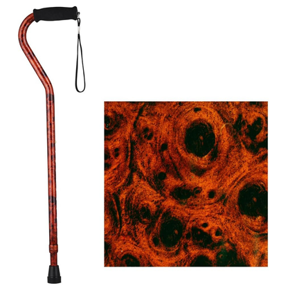 The Nova Designer Offset Walking Cane features a black handle, wrist strap, and an orange and black swirled woodgrain pattern; a close-up of this design appears beside the cane.