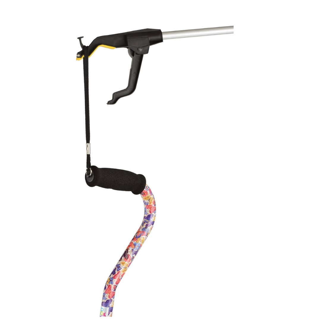 A Nova Medical Dragon Reacher (Pack of 2), with a 360° rotating gripper, holds a multi-colored walking cane with a black foam handle, displayed against a white background.