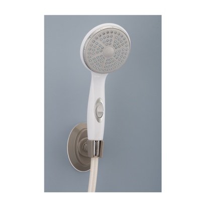 The Nova Suction Cup Showerhead Holder in silver secures a white, multi-nozzle handheld showerhead against a light blue-gray wall, holding the shower hose firmly in place as it extends downward.
