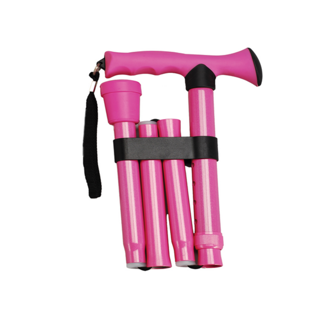 The Nova Folding Cane with Soft Rubber Handle is a bright pink, lightweight cane featuring a slip-resistant curved handle and black wrist strap, held together with a black band and displayed on a white background.